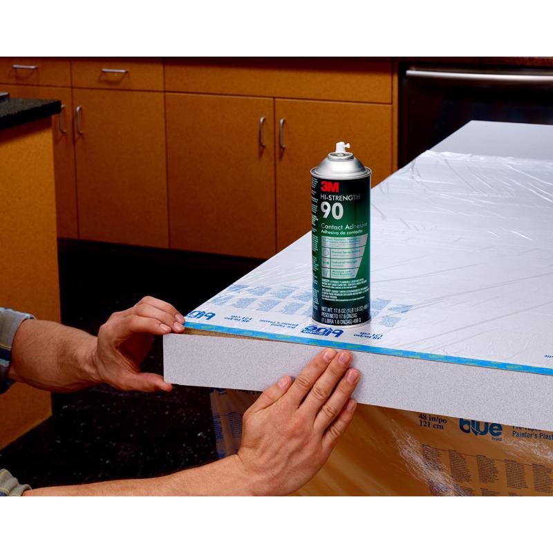 3M Hi-Strength 90 Spray Adhesive being used to repair laminate trim peeling off a counter.