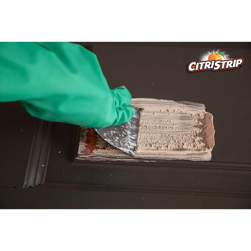 Klean Strip Citristrip Stripping Gel shown being used to remove paint from a door with a scraper.