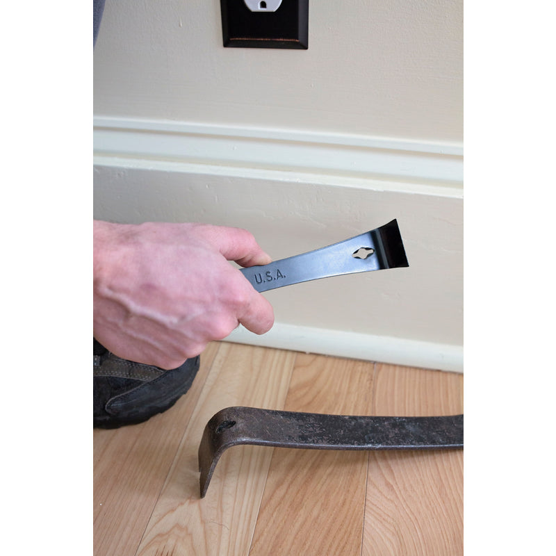 Hyde Tools Pry Bar/Scraper 45600 being used to remove floor trim.