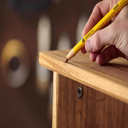 Minwax Blend-Fil Pencil being used on a piece of furniture.