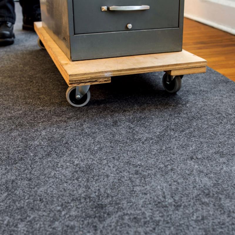Surface Shields Pro Shield Surface Protector under a filing cabinet being rolled on a cart.