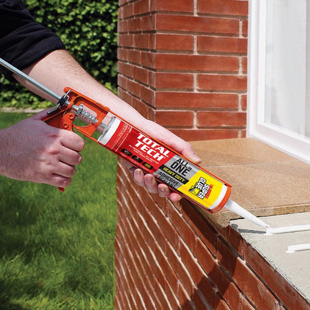 The Original Super Glue Total Tech Construction Adhesive Sealant being applied to a tile window ledge outside.