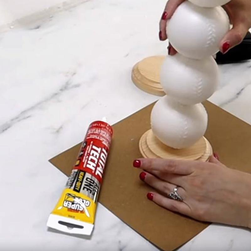 The Original Super Glue Total Tech Construction Adhesive Sealant being applied to repair a figurine.