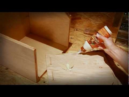 Gorilla Wood Glue being applied to seams on a wooden box.
