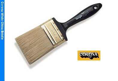 The image shows the Corona Hull White China Paint Brush 3125 up close, showcasing its hand-formed chisel and glossy black lacquered plastic foam beavertail handle. 