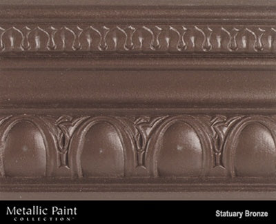Modern Masters Precious Metals ME190 Statuary Bronze shown painted on a piece of crown molding.