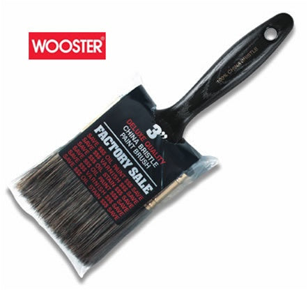 he image showcases the Wooster Factory Sale Gray Bristle Paint Brush Z1101. The brush has a black solid plastic handle and features gray bristles. The brass-plated steel ferrule securely holds the bristles in place.