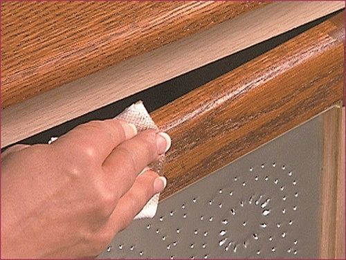 UGL ZAR Oil Based Wood Stain Gallon being applied to a piece of furniture.
