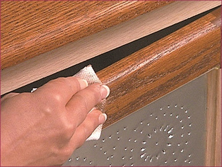 UGL ZAR Oil Based Wood Stain Gallon being applied to a piece of furniture.
