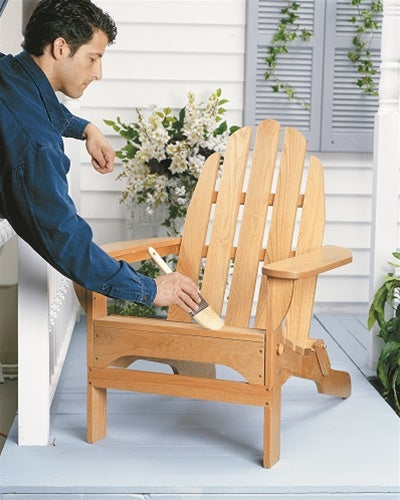 UGL ZAR® Exterior Water-Based Polyurethane being applied with a paint brush to a wooden chair.