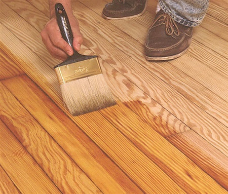 UGL ZAR® Ultra Interior Oil-Based Fast Drying Polyurethane being applied to a wood floor with a paint brush.