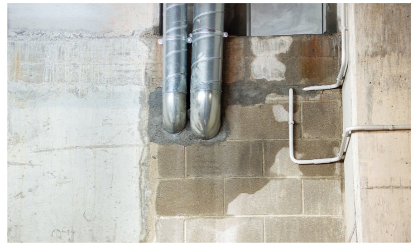 Leaking cinder block wall