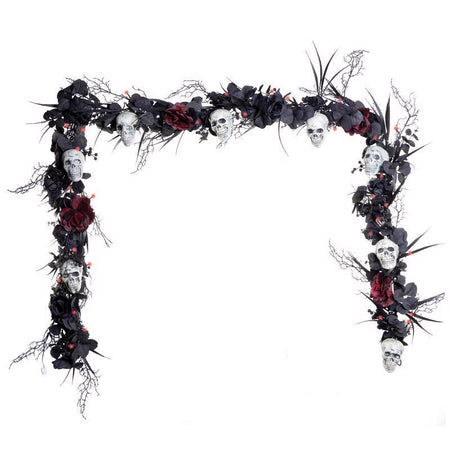 Decorative garland with skulls, flowers, and branches on a white background