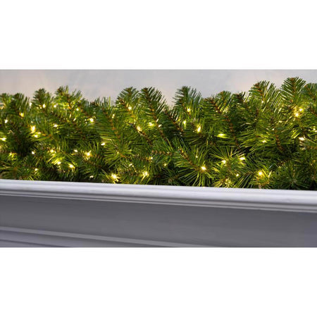 Decorative Christmas garland with lights on a white background
