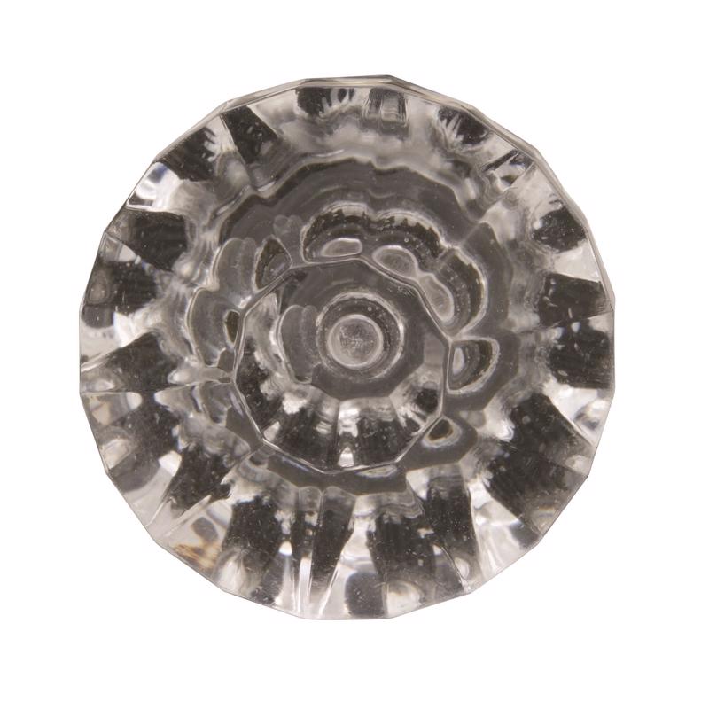 Clear glass knob with decorative pattern on a white background