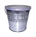 Metal bucket candle with 'Patio Essentials' branding on a white background