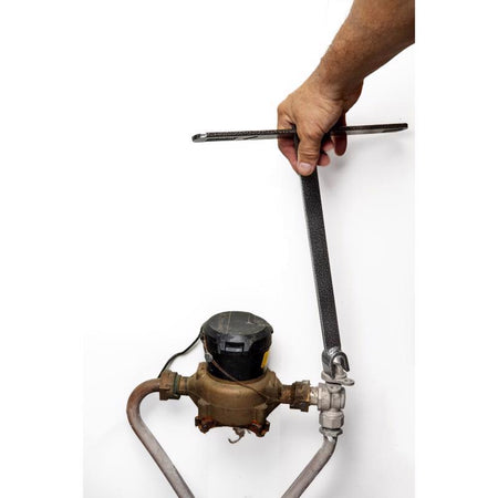 Hand using a Superior Tool Shut-Off Wrench on a valve against a white background