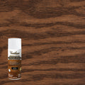 A can of Varathane Premium Fast Dry Wood Stain in the Dark Walnut color, shown against a large background of the stained wood grain texture.