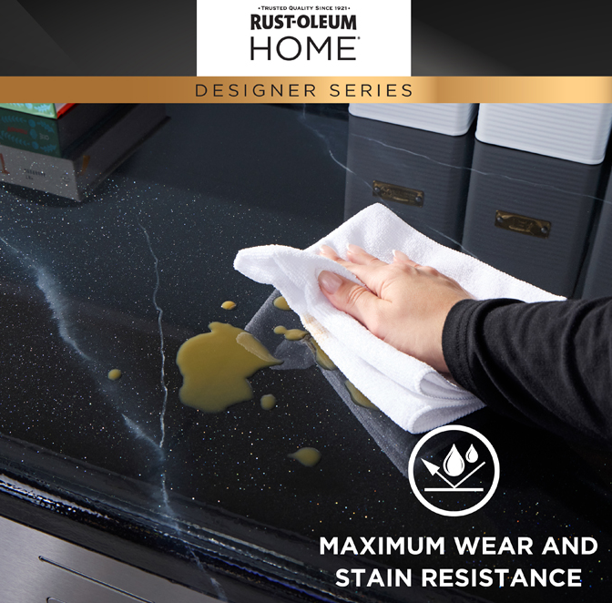A hand wipes spilled oil from a dark, stain-resistant countertop with a white cloth. The image includes a black header with the text 'Rust-Oleum Home Designer Series' and a badge reading 'Maximum Wear and Stain Resistance'.