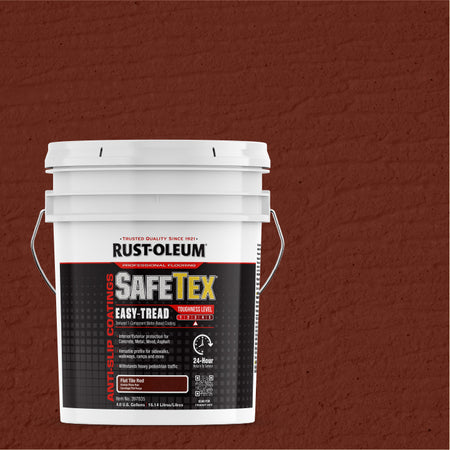 A white plastic bucket of Rust-Oleum SafeTex Easy-Tread paint, shown against a textured tile red wall background.