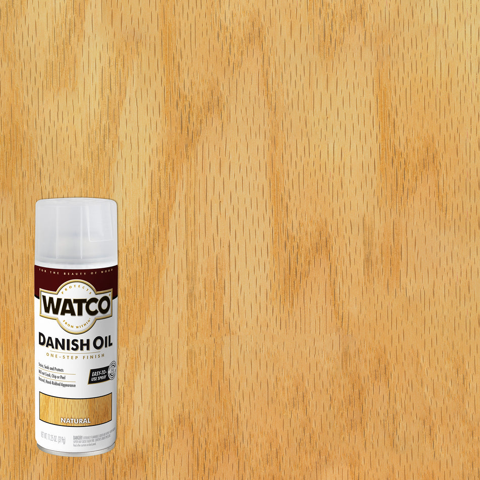 A can of Watco Danish Oil wood finish in the Natural shade, shown against a background of the same light natural wood grain texture.