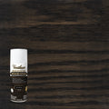 A can of Varathose Premium Fast Dry Wood Stain in the color Jet Black, shown against a dark wood grain background that demonstrates the stain's effect.