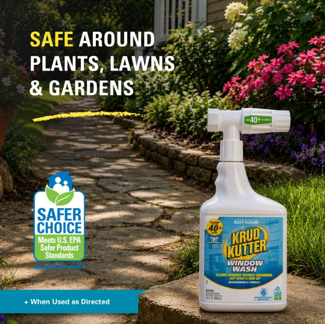 Krud Kutter window wash spray bottle displayed on a stone pathway in a landscaped garden, with marketing text reading 'SAFE AROUND PLANTS, LAWNS & GARDENS' and a Safer Choice badge.