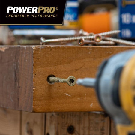 Drill screwing into wood with PowerPro logo in the background