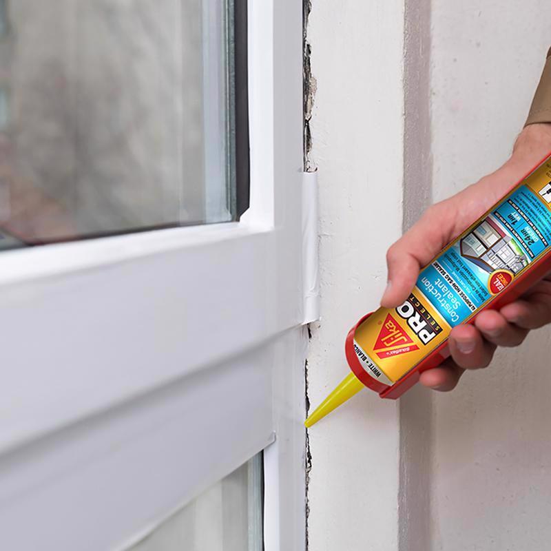 Person applying Sikaflex Construction Sealant to a window frame