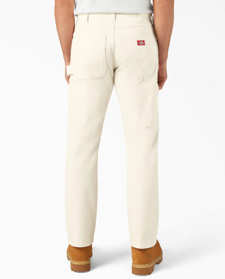 Back view of person wearing Dickies Natural Relaxed Fit Painter's Pants with a visible brand logo on a white background