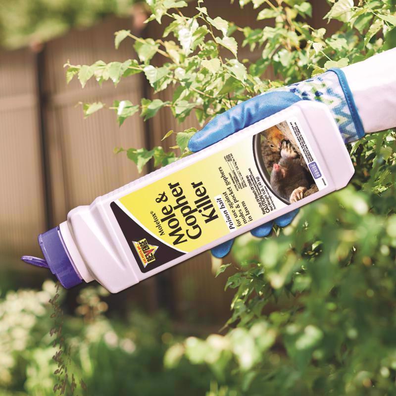 Revenge Moletox Mole & Gopher Killer being applied to bushes