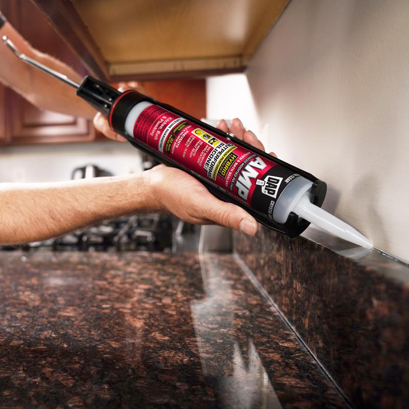 DAP 00762 9 Oz White AMP Kitchen & Bath Sealant being used to seal kitchen counter edge.