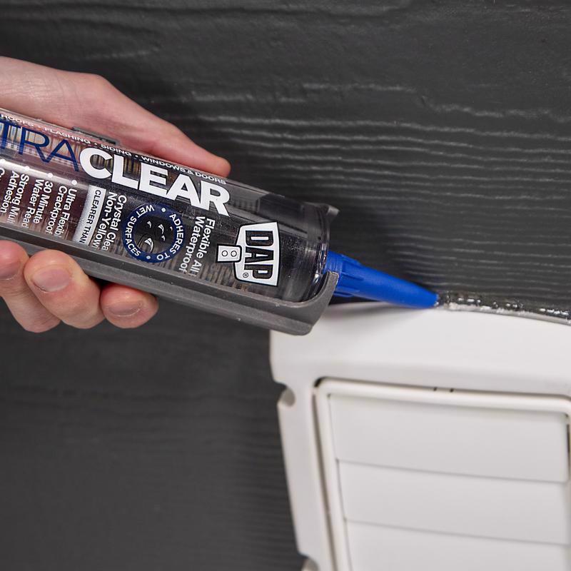 DAP 10.1oz Ultra Clear All Purpose Flexible Sealant being applied to a crack around a vent.
