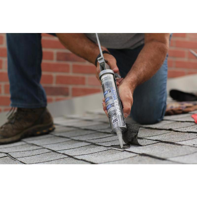 DAP Ultra Clear Roof Waterproof Rubberized Sealant being applied under a roof shingle