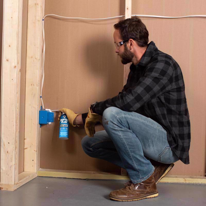 Man applying DAPtex Plus Window & Door Foam Sealant around electrical box.