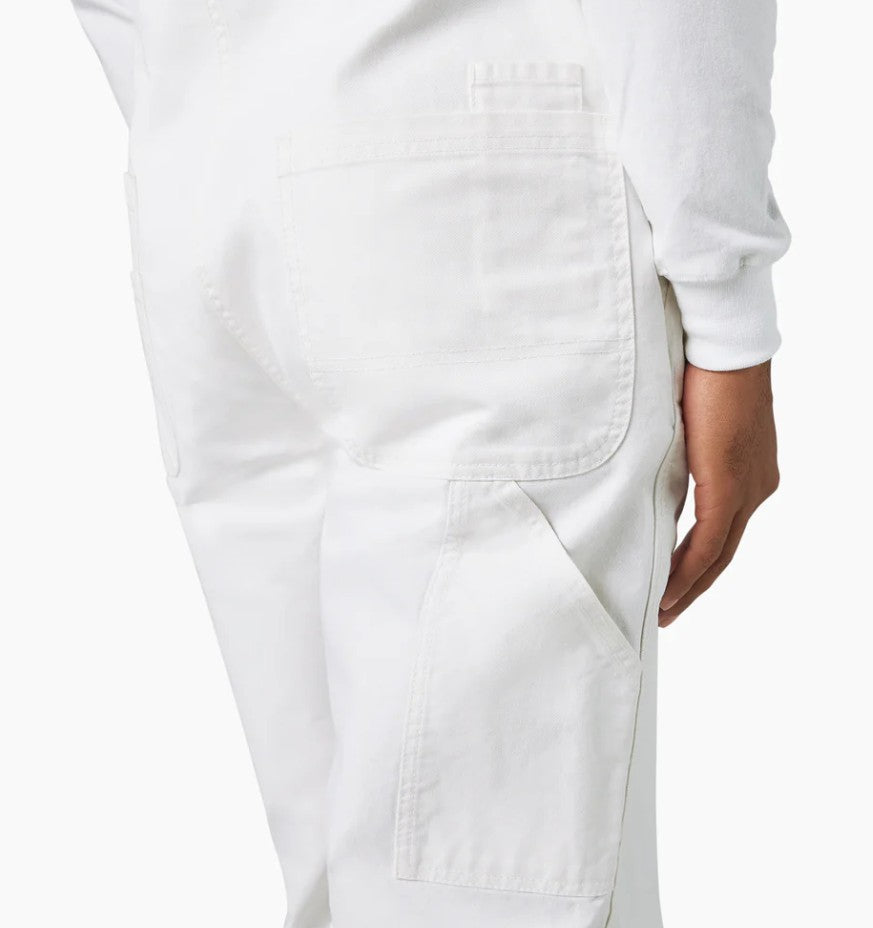 Back view of Dickies White Painter Bib Overalls Relaxed Fit worn by a person on a white background