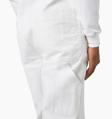 Back view of Dickies White Painter Bib Overalls Relaxed Fit worn by a person on a white background