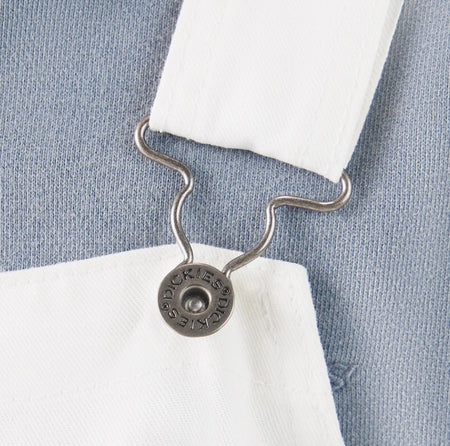Dickies White Painter Bib Overalls Relaxed Fit hook on a blue fabric background
