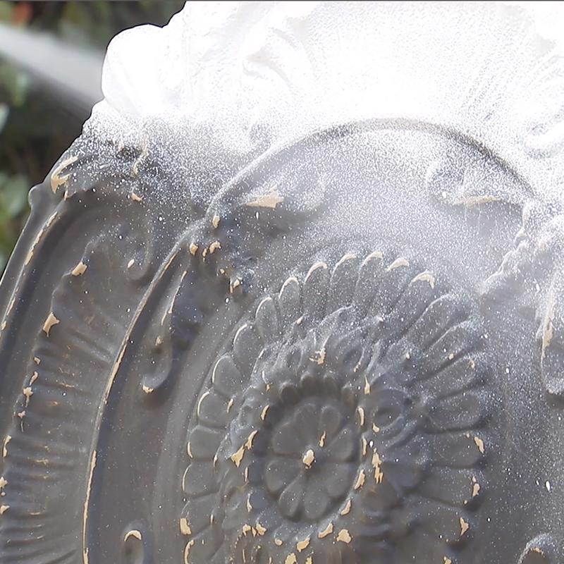 Spraying a ornamental piece with Flex Seal Brite