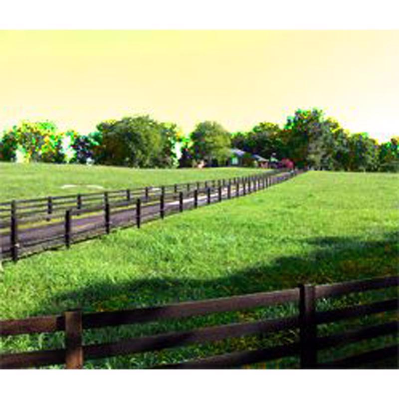 Lush green field with wooden fence painted with Gardner Black Beauty Asphalt Fence Post Paint and trees under a bright sky