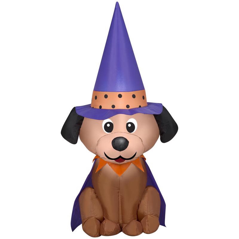 Inflatable dog with a purple witch hat and cape on a white background