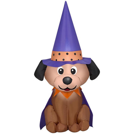 Inflatable dog with a purple witch hat and cape on a white background