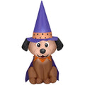 Inflatable dog with a purple witch hat and cape on a white background