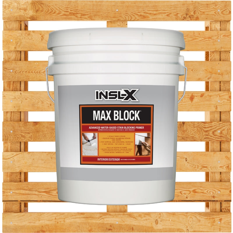 White bucket of INSL-X Max Block paint on a wooden pallet background