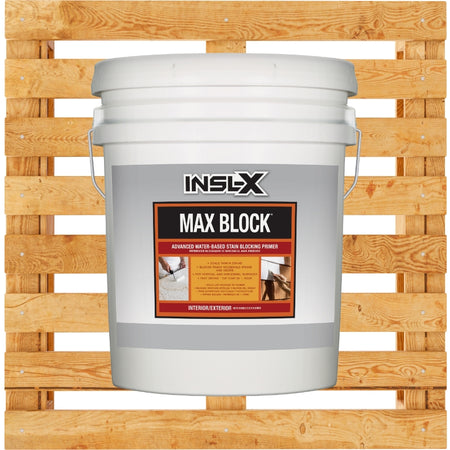 White bucket of INSL-X Max Block paint on a wooden pallet background