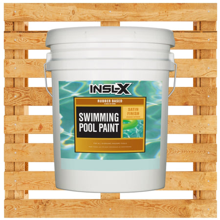 White pail of Insl-X rubber based pool paint on a wooden pallet background