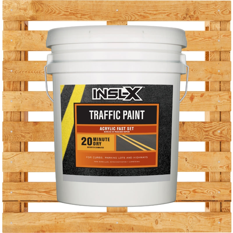 INSL-X Traffic Paint bucket on a wooden pallet background