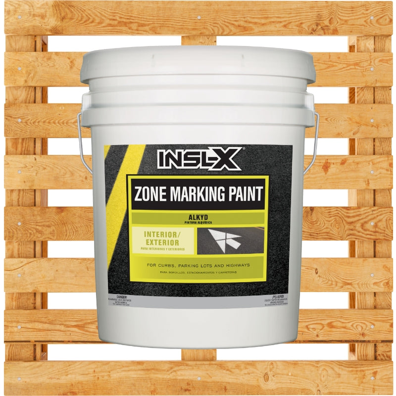 White bucket of INSL-X Zone Marking Paint on a wooden pallet