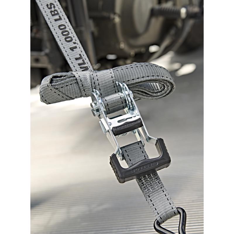 Keeper 1 in. W X 12 ft. L Gray High Tension Ratchet Tie-Down being used to strap down a vehicle.