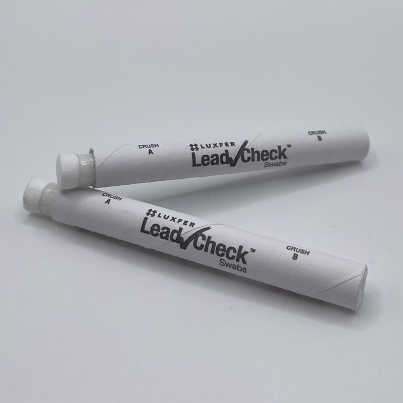 Three Luxfer LeadCheck swab packages on a white background